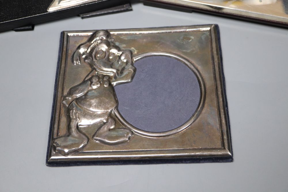 Three assorted modern mounted photograph frames including two silver, largest 20.2cm.